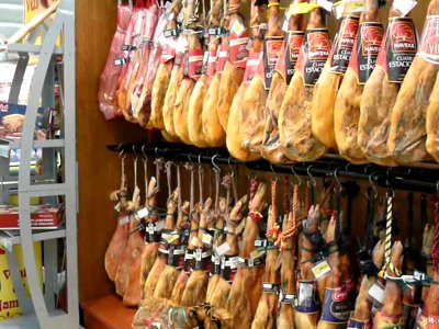 stock-footage-pan-across-legs-of-cured-ham-hanging-in-a-supermarket.jpg