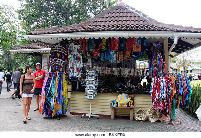 western-tourists-looking-for-colourful-dresses-and-curios-displayed-bkkfrx.jpg